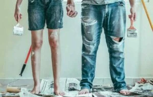 couple redecorating with paint on a budget