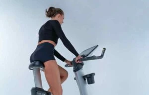 woman on bike going after her new years goals