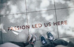 passion led us here sidewalk art