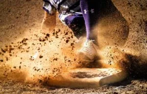 Sliding into homebase on baseball field