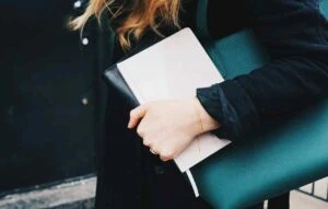 professional organizer going to work with papers and bag
