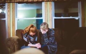 two grieving family members getting help organizing