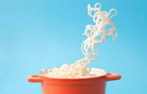 cooking pot with noodles magically in air