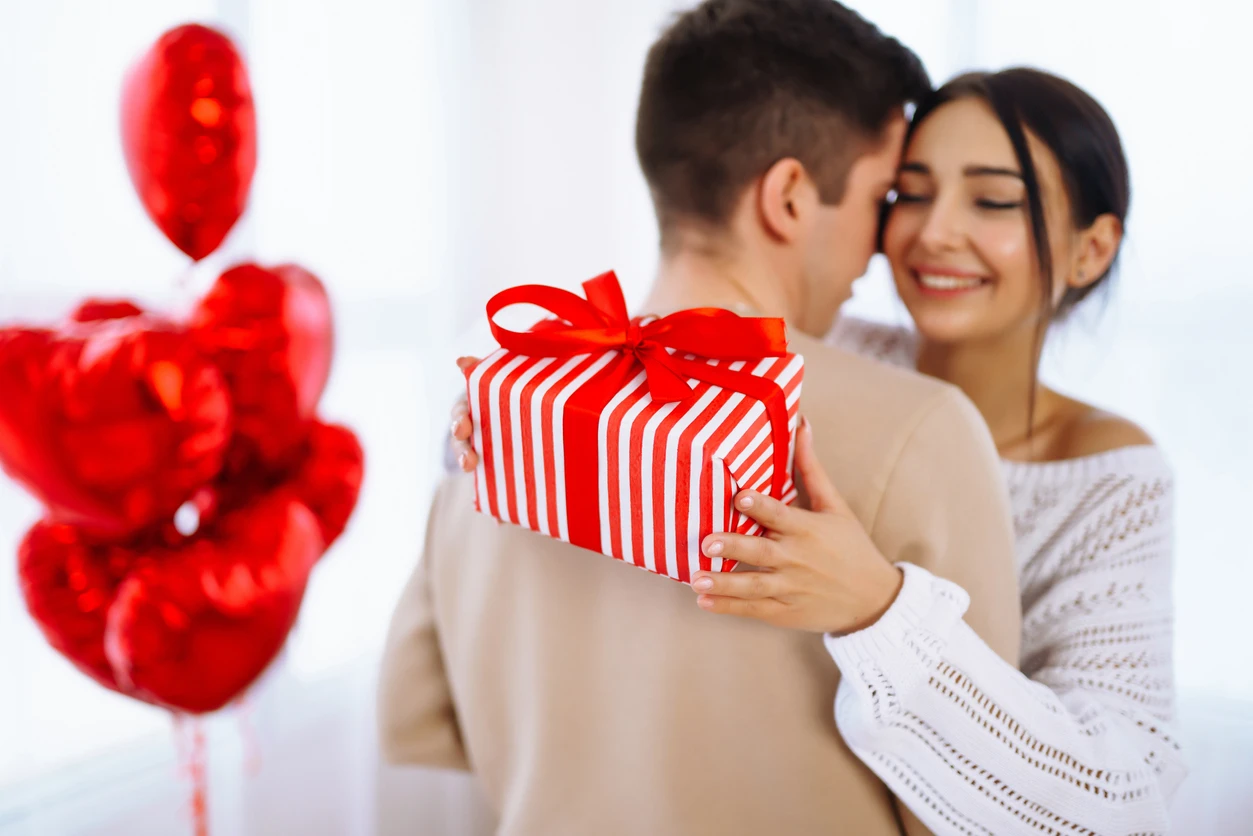 Happy lady receiving valentine gift
