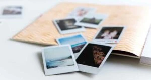 photos piled on a scrapbook