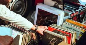 organizing piles of records as a part of decluttering project