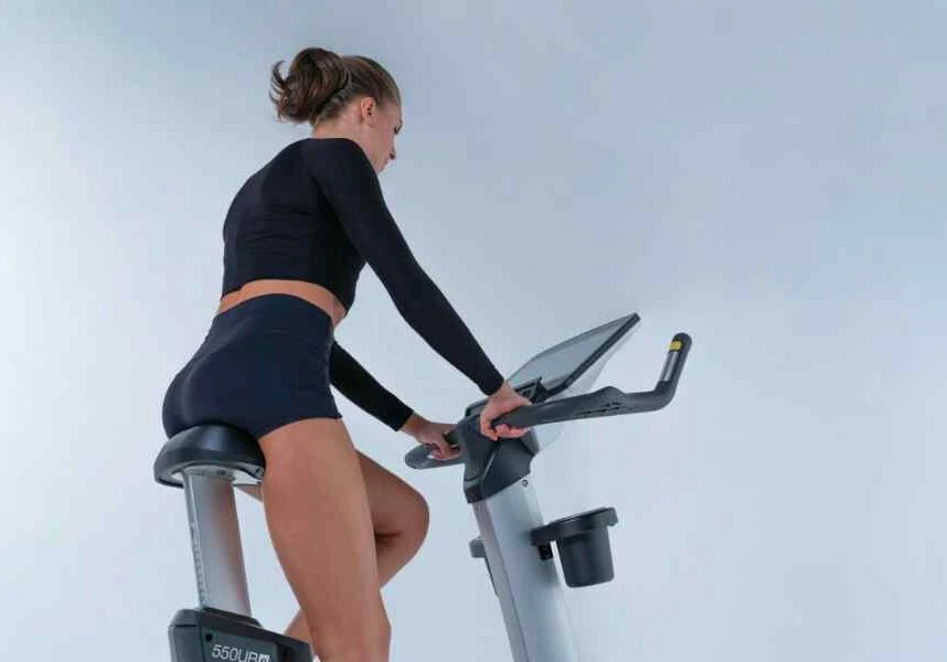 woman on bike going after her new years goals