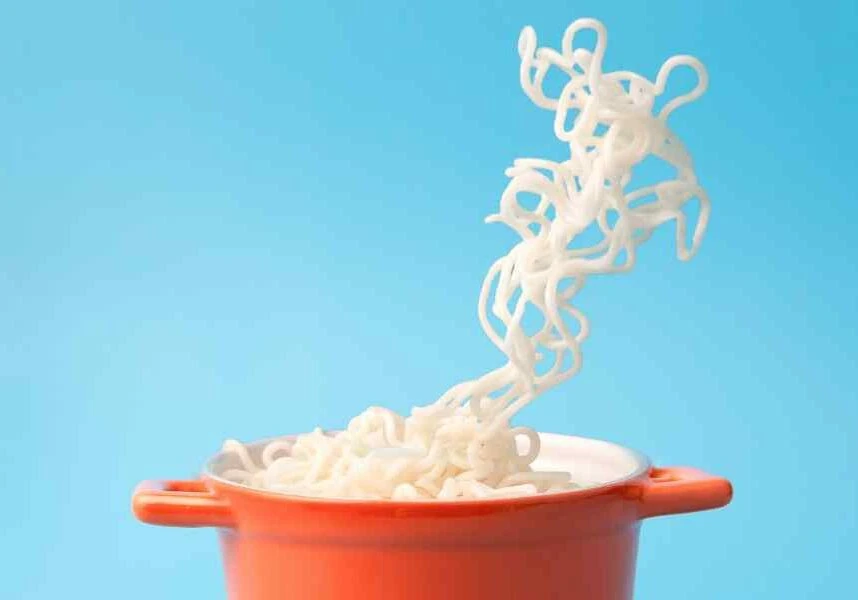 cooking pot with noodles magically in air