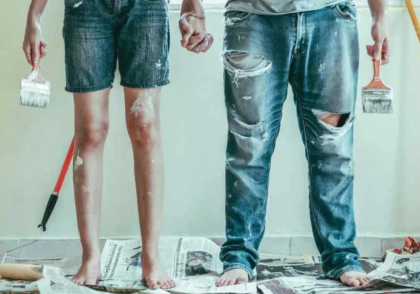 couple redecorating with paint on a budget