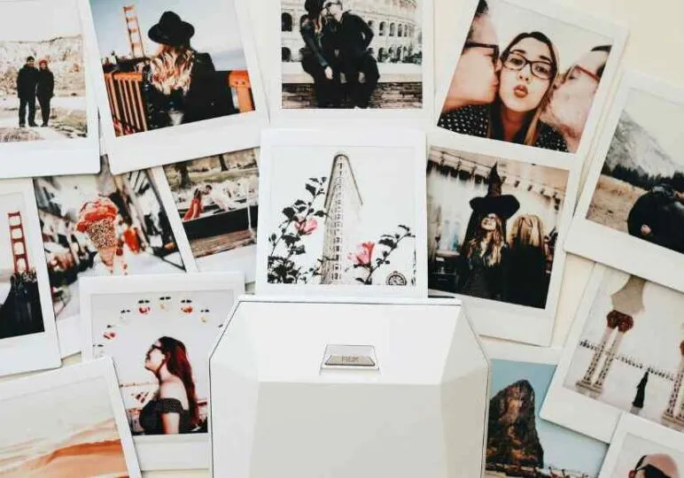 photos laid out next to a digital photo scanner