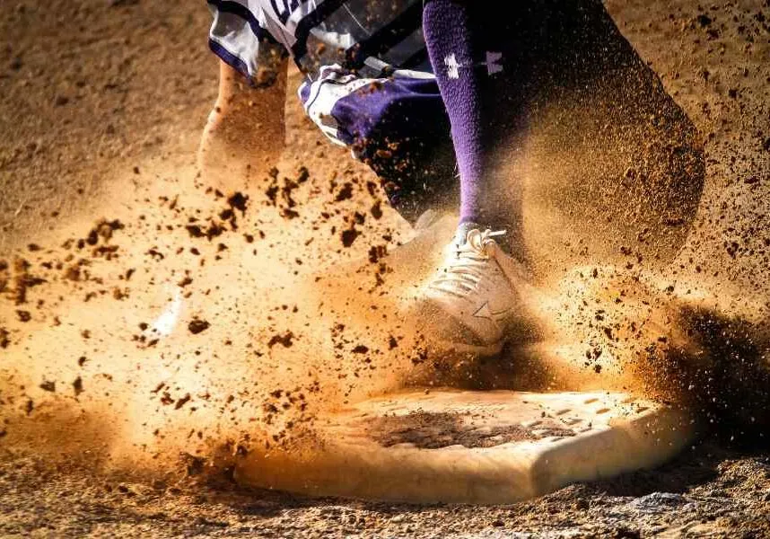 Sliding into homebase on baseball field