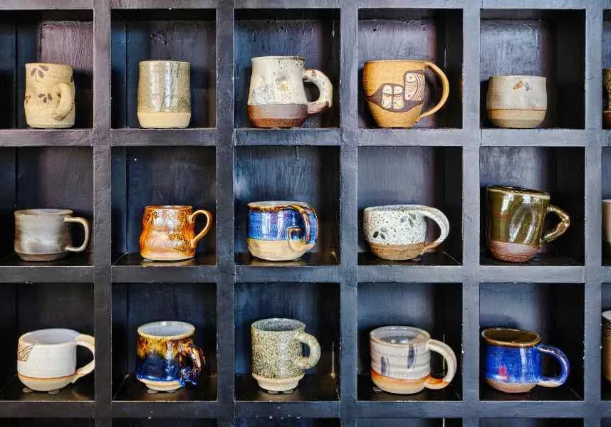 lots of mugs on a shelf made easy to reach with organizing