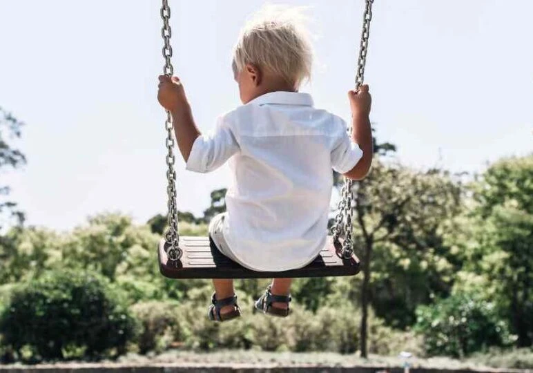 child on swing at home feeling peaceful, Home Organization Tips for busy parents