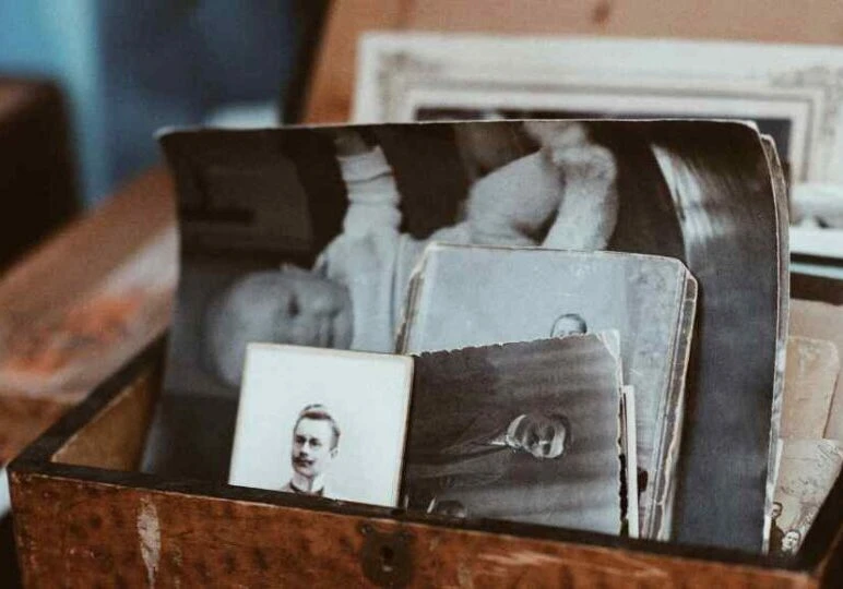 sentimental keepsakes, old photos in a keepsake box