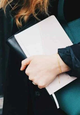 professional organizer going to work with papers and bag